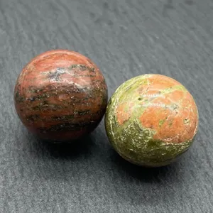 Detail close-up of natural crystal stone spheres, polished round mineral gemstone decor specimen.