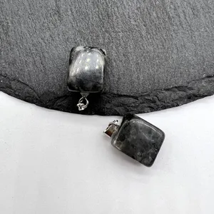 Close-up detail shot of natural stone irregular square pendant necklace, exquisite jewelry part.