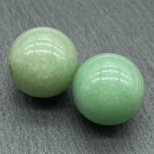 Natural green crystal stone sphere detail shot, 20mm polished gemstone round ball decor specimen.