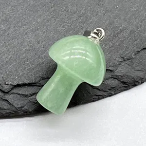 Exquisite green crystal mushroom pendant detail view, mini gemstone jewelry charm for DIY crafting.