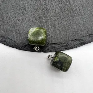 Green natural stone irregular square pendant detail shot featuring a silver metal bail