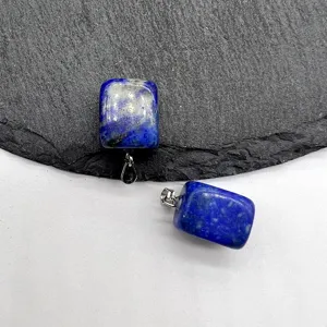 Detailed close-up view of natural lapis lazuli square gemstone pendant showcasing unique texture.