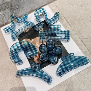 Detailed view of blue plaid hair claws in various shapes, perfect for stylish daily hairstyles.