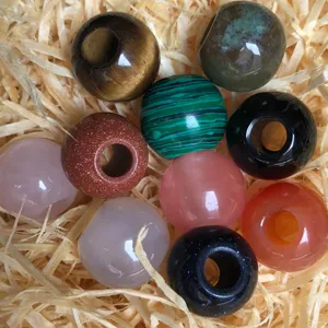 Close-up detail of natural gemstone beads, large hole crystal and agate beads for DIY crafts.