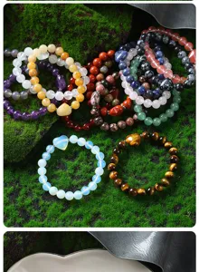 Natural crystal stone beaded bracelets set featuring amethyst tiger eye and heart charms detail.