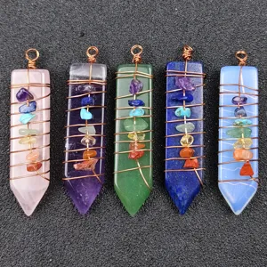 Detailed view of natural crystal chakra stone hexagonal point wire wrapped pendant jewelry set.