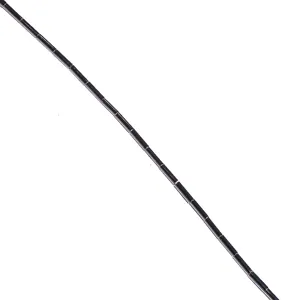 Detailed view of black cylindrical gemstone tube loose beads, perfect for DIY jewelry making.