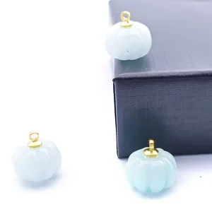 Detailed view of carved jade pumpkin DIY pendant, beautiful crystal jewelry accessory for necklace.