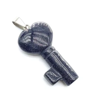 Blue sandstone heart key pendant close up, exquisite crystal gemstone jewelry detail view.