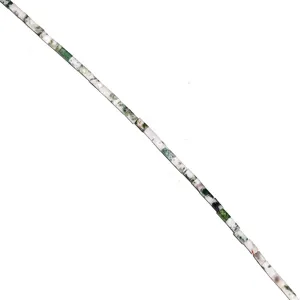 Detail shot of natural stone crystal tubular loose beads in green and white cylindrical shape.