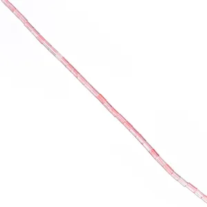 Close-up detail of pink crystal tube loose beads for DIY jewelry making and crafting accessories.