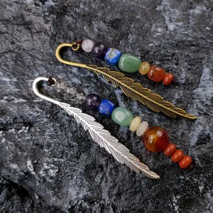 Metal feather bookmark with colorful chakra crystal gemstone beads, vintage stationery item.