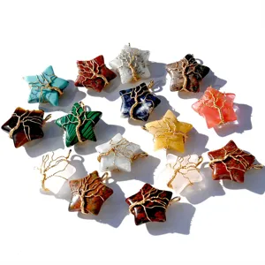 Closeup of multi-color crystal star pendants with wire wrapped tree of life design.