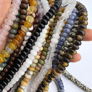 Close-up of 5x8mm natural crystal gemstone abacus beads spacer strands for DIY jewelry making.