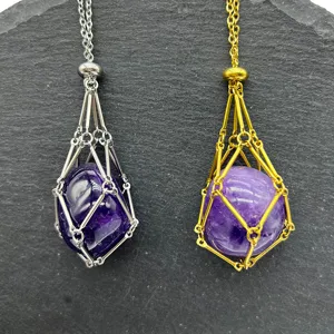Stainless steel crystal cage pendant detail, adjustable chain with purple crystal stone inside.
