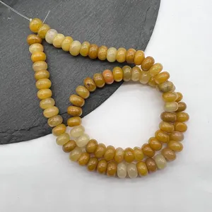 Close-up detail of natural gemstone abacus beads, smooth cut for DIY jewelry making accessories.