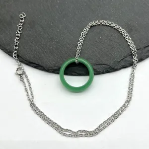 Green stone ring pendant with silver chain retro style jewelry accessory detail view
