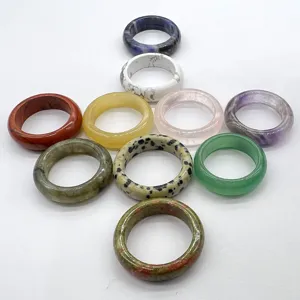 Detailed showcase of natural stone rings featuring colorful crystal and agate options.