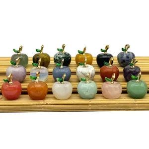 Detailed view of assorted natural crystal stone apple pendants, colorful gemstone DIY jewelry charms.