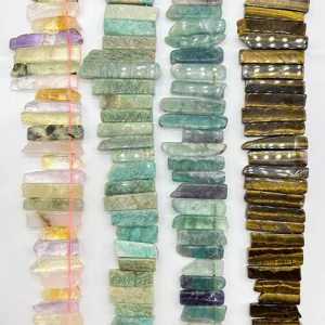 Natural stone bead strands detail shot, showing assorted gemstone shapes for DIY jewelry making.