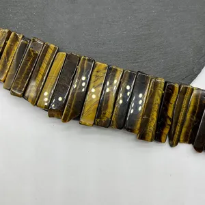 Natural tiger eye stone rectangular tube bead detail closeup shot for DIY jewelry making.