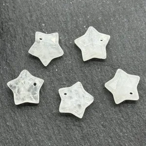 Faceted crystal star pendant detail view, 12mm clear stone star charms for DIY jewelry making.
