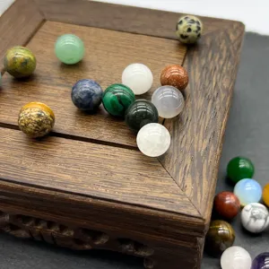 Close-up detail of colorful natural gemstone round beads for DIY jewelry making and crafting.