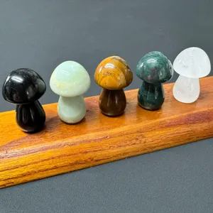Closeup of colorful natural crystal stone mushroom carvings, perfect for mini garden decor.