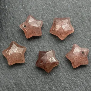 Faceted star crystal pendant detail showing sparkling stone texture and drilled hole for DIY jewelry.