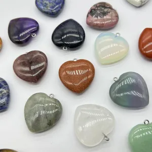 Detailed close-up view of assorted gemstone heart pendants, perfect for DIY jewelry making accessories.