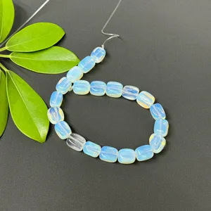 Close-up detail of light blue rectangular loose beads strand for DIY jewelry making accessories.