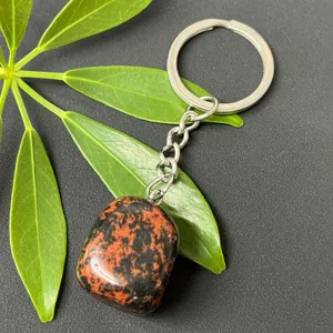 Natural gemstone tumbled stone keychain with stainless steel ring and polished crystal charm.