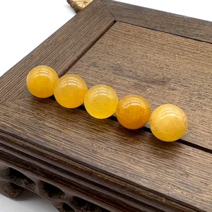 Close up of yellow crystal semi precious stone round loose beads detail shot for diy jewelry making.