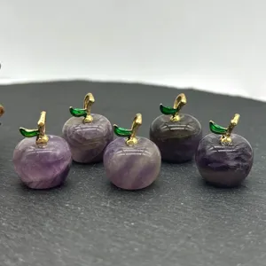 Amethyst crystal apple charms detail with gold stems and green leaves for DIY jewelry.