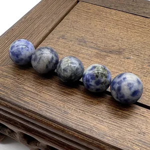 Detailed close-up shot of natural blue spot stone round beads for DIY jewelry making parts.