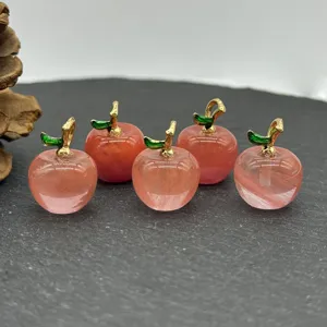 Detail view of pink crystal apple pendant with gold bail for DIY jewelry necklaces earrings.