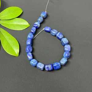 Close-up detail of natural lapis lazuli square loose beads, perfect for DIY jewelry making.