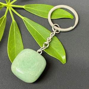 Natural green crystal tumbled stone keychain with stainless steel ring for keys and bag decor.