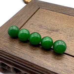 Green gemstone loose beads detail shot, smooth round 10mm stone spheres for DIY jewelry making