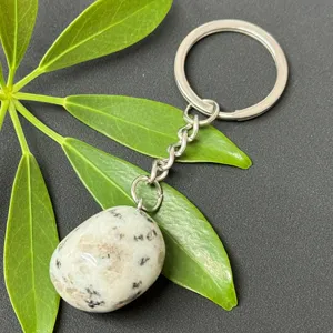 Natural crystal tumbled stone stainless steel keychain detail showcasing polished mineral pendant.