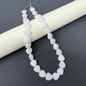 Heart-shaped natural stone beads close-up, perfect for DIY jewelry making accessories.