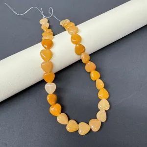 Close-up detail of 12mm natural stone heart gemstone beads, perfect for DIY jewelry making.