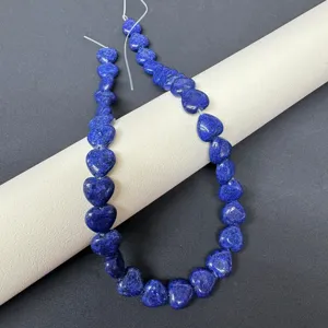 Natural blue gemstone heart beads detail shot, perfect for DIY jewelry necklace parts.