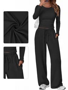 Black long sleeve crop top and wide leg pants set detail view, casual lounge two piece outfit.