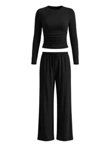 Detailed view of black long sleeve top and wide leg pants lounge set with gathered waist design.