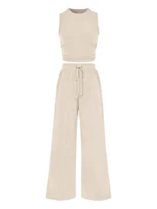 Beige ribbed two piece set for women featuring a crop tank top and high waist wide leg pants.