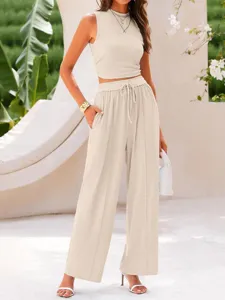 Detailed view of the solid ribbed two-piece crop top and high-waist wide-leg pants set.