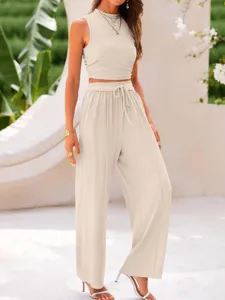 Elegant ribbed two-piece outfit featuring a slim crop tank top and high waist wide leg pants.