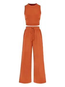 Ribbed tank top and wide-leg pants detail, textured fabric, sleeveless slim fit, casual wear.