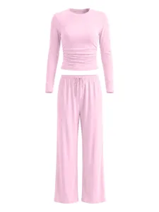 Pink long sleeve top and wide-legs pants lounge set detail showcasing soft fabric and drawstring.